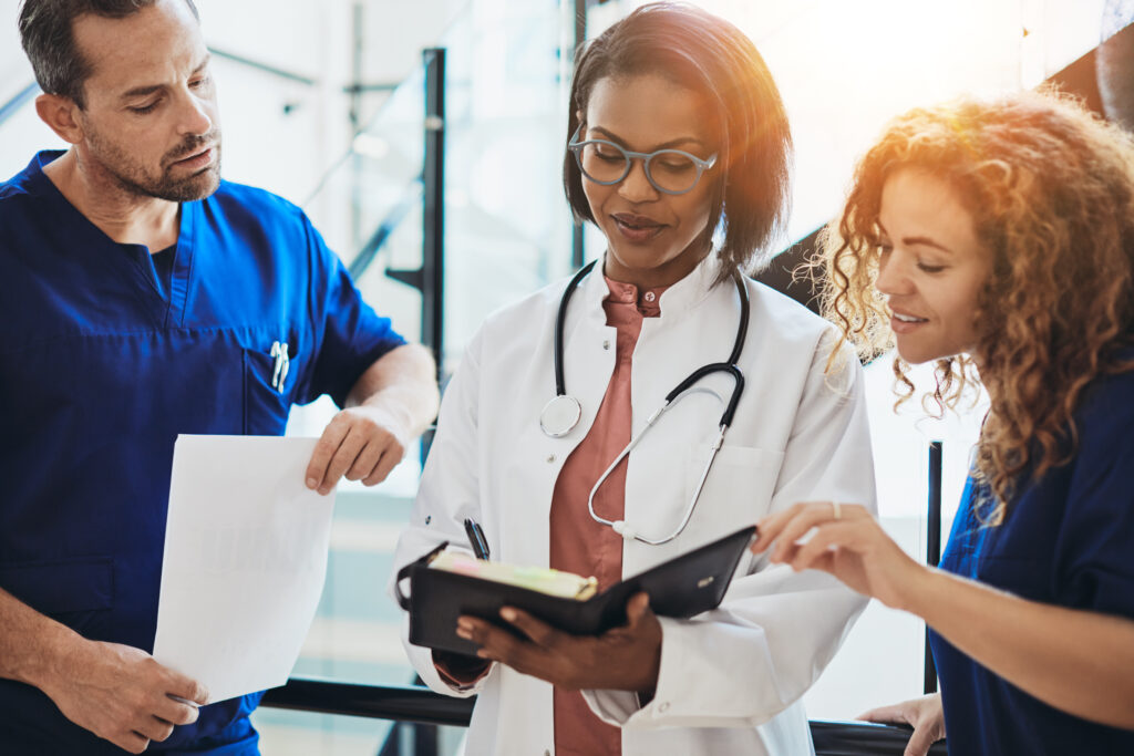 Diverse,Group,Of,Young,Doctors,Standing,Together,In,A,Hospital